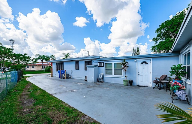 back of property featuring a patio