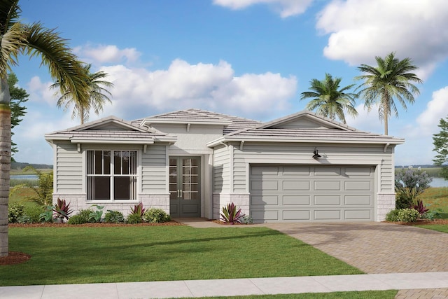 view of front of home featuring a garage and a front yard