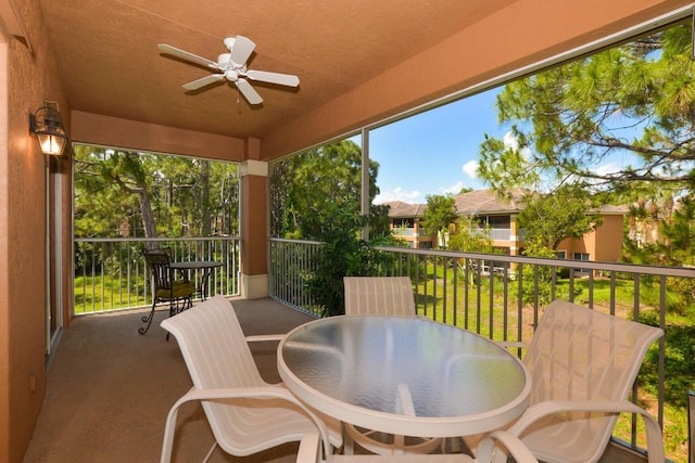 exterior space with ceiling fan