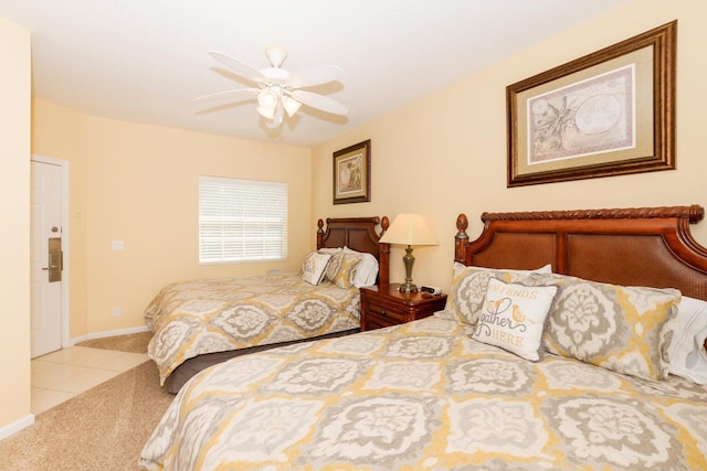 bedroom featuring ceiling fan and light colored carpet