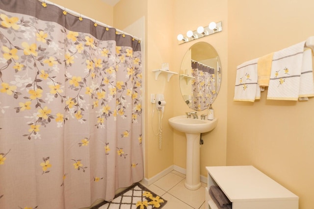 bathroom with tile patterned floors and sink