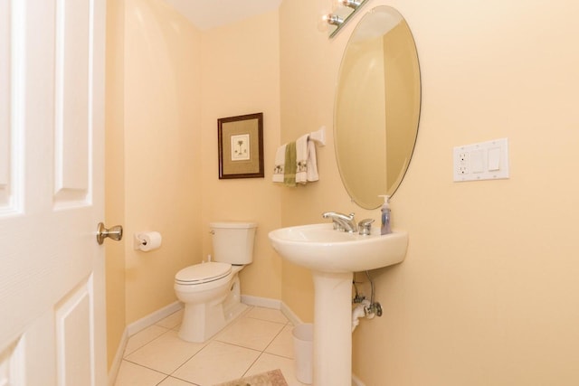 bathroom featuring tile patterned floors and toilet