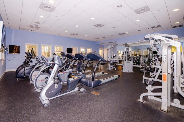 workout area featuring a paneled ceiling