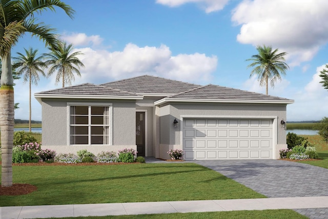 view of front of home featuring a water view, a front lawn, and a garage