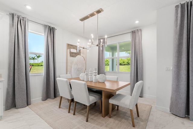 dining area with recessed lighting, baseboards, a notable chandelier, and marble finish floor