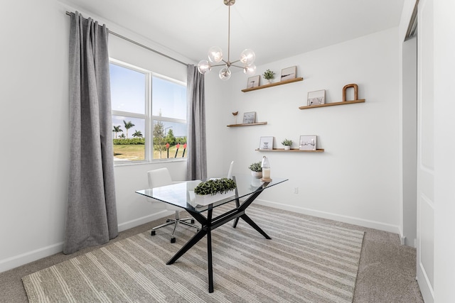 office area with baseboards, carpet floors, and a notable chandelier