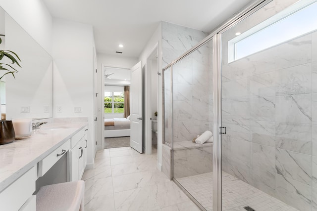 ensuite bathroom with vanity, recessed lighting, a stall shower, ensuite bathroom, and marble finish floor