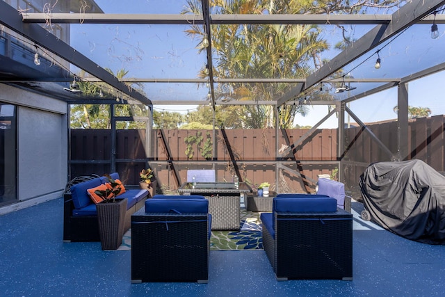 view of patio featuring glass enclosure and outdoor lounge area