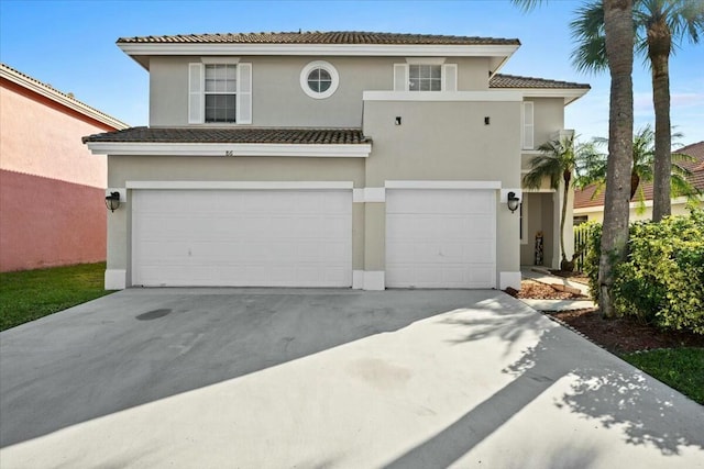 mediterranean / spanish-style home featuring a garage