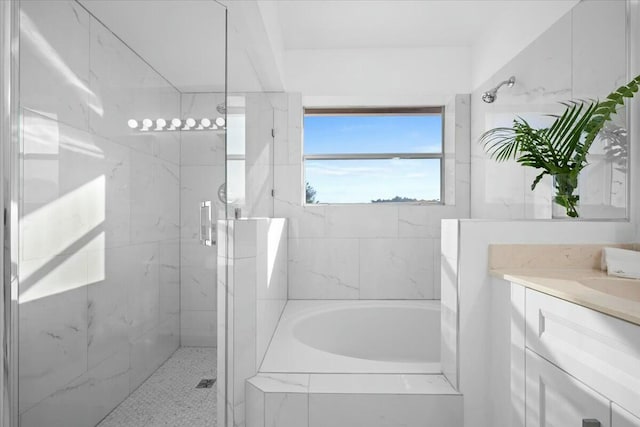 bathroom with separate shower and tub and vanity