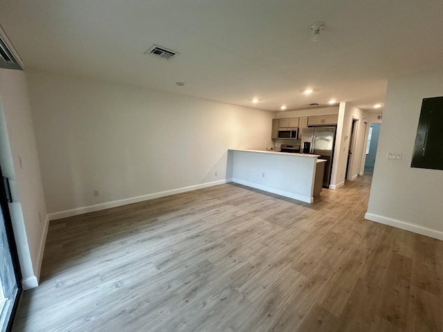 unfurnished living room with light wood-type flooring