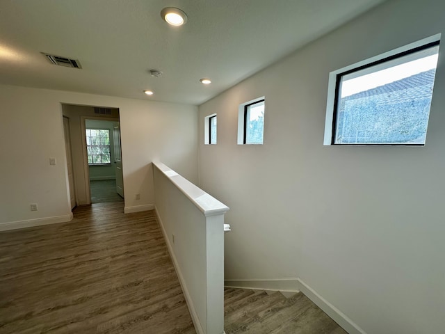 hall with dark hardwood / wood-style floors