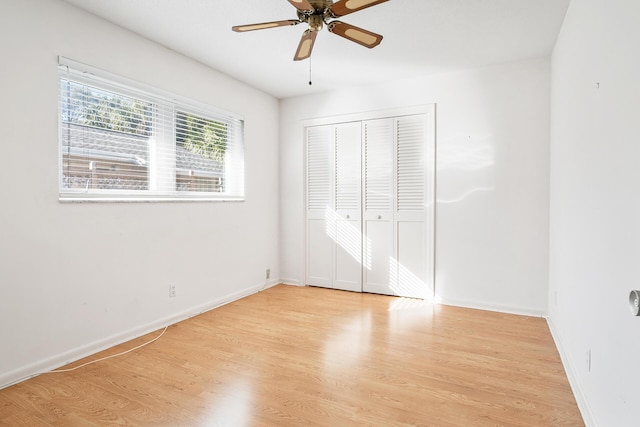 unfurnished bedroom with a closet, ceiling fan, and light hardwood / wood-style floors