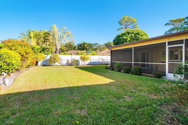 view of yard featuring a sunroom