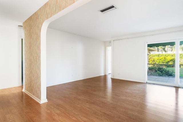 empty room featuring wood-type flooring