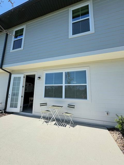 rear view of property featuring a patio area