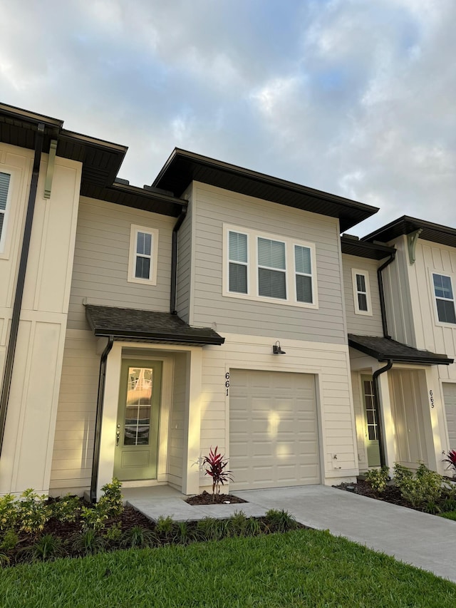 view of front of property with a garage