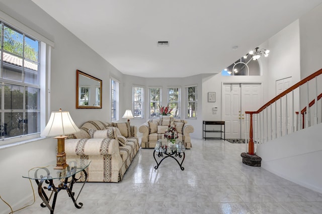 living room featuring a notable chandelier and plenty of natural light