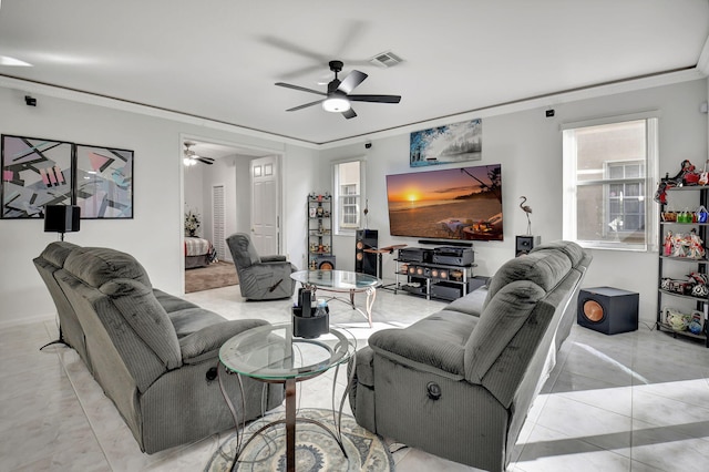 living room featuring crown molding and ceiling fan