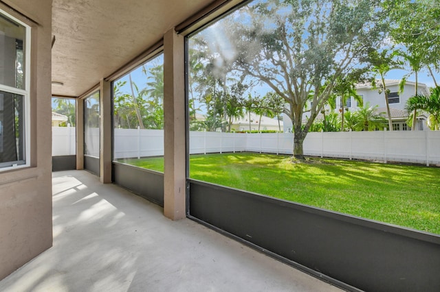 unfurnished sunroom featuring a wealth of natural light