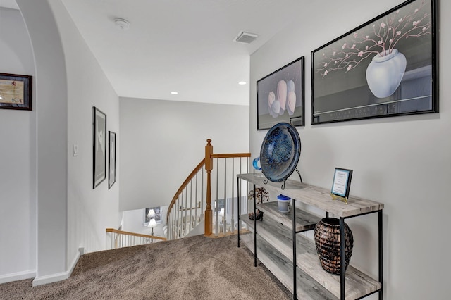 hallway with carpet floors