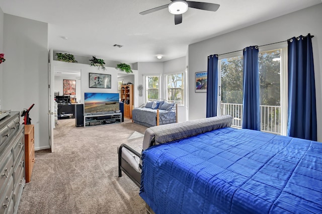 bedroom featuring ceiling fan, access to exterior, and light colored carpet