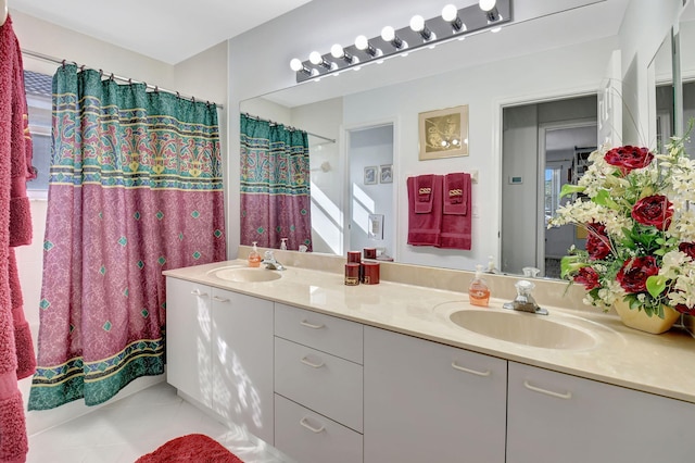 bathroom with tile patterned flooring and vanity