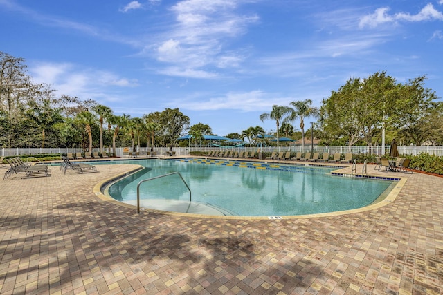 view of swimming pool with a patio