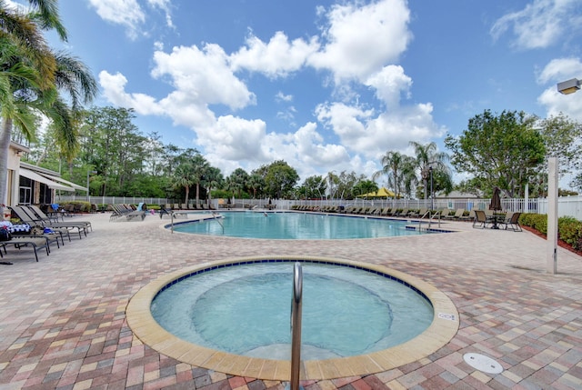 view of pool featuring a patio area and a community hot tub