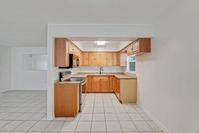 kitchen featuring light tile patterned floors, a textured ceiling, stainless steel range with electric stovetop, and sink