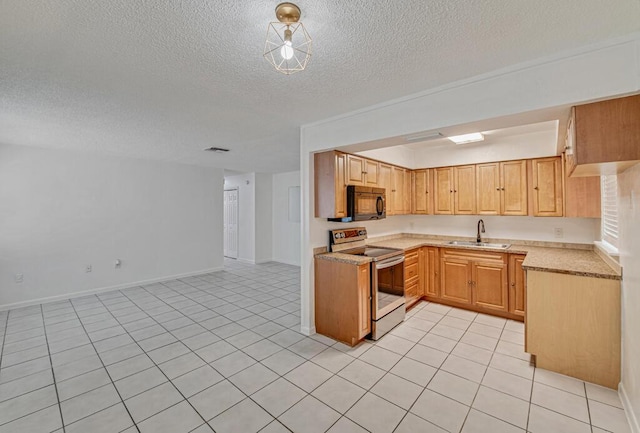 kitchen featuring electric range, light tile patterned flooring, sink, and a textured ceiling