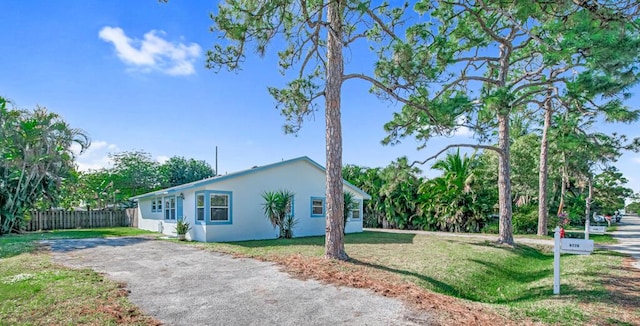 view of home's exterior featuring a yard