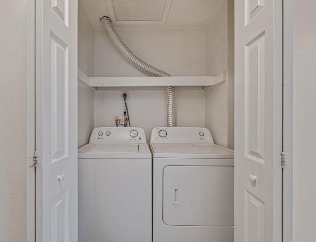 clothes washing area with washer and dryer