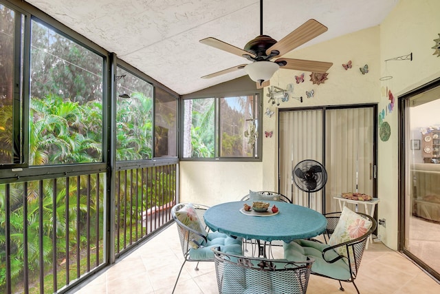 sunroom / solarium with lofted ceiling and ceiling fan