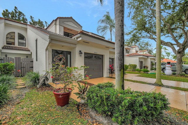 view of front of property with a garage and stucco siding