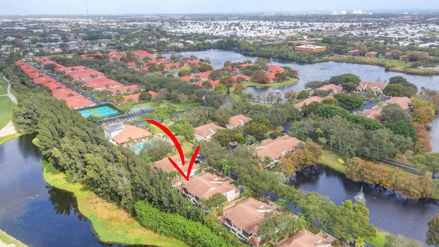 drone / aerial view featuring a water view and a residential view