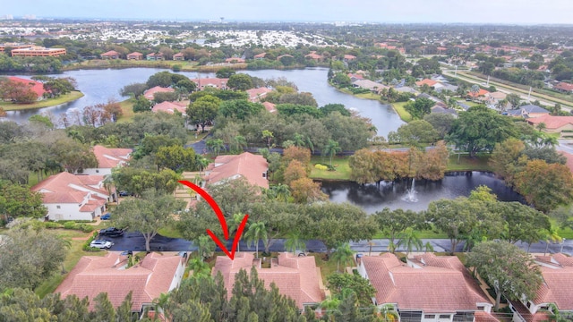 birds eye view of property featuring a water view and a residential view