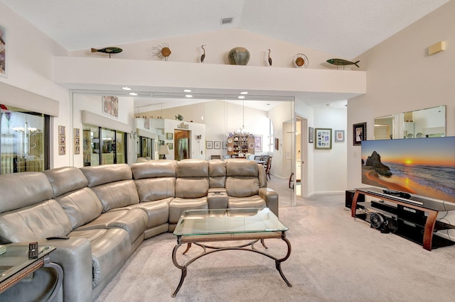 living room featuring lofted ceiling, light carpet, visible vents, and an inviting chandelier