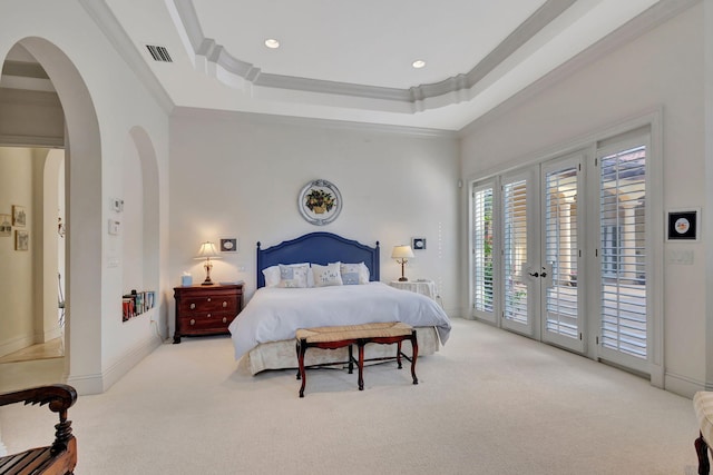 carpeted bedroom featuring french doors, access to outside, a raised ceiling, and crown molding