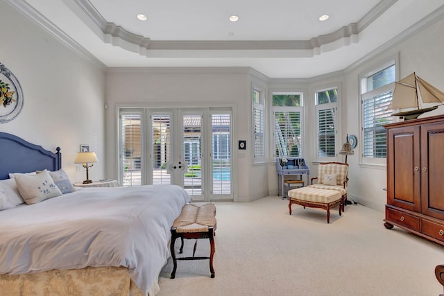 carpeted bedroom featuring a tray ceiling, french doors, access to outside, and ornamental molding