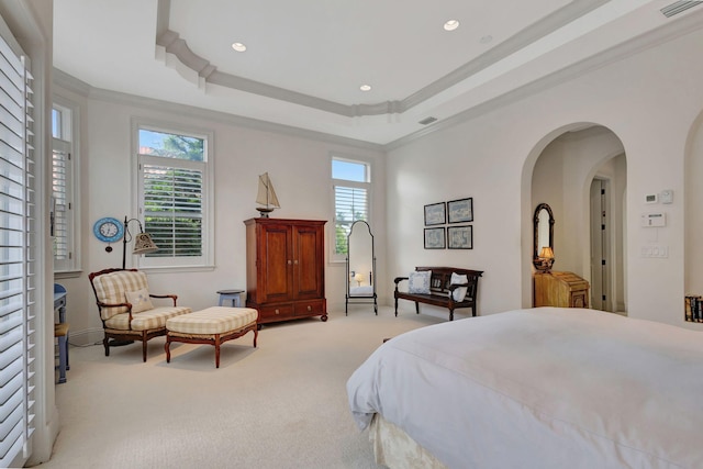 bedroom featuring multiple windows, light carpet, and ornamental molding