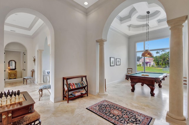 recreation room featuring a towering ceiling, crown molding, pool table, and ornate columns