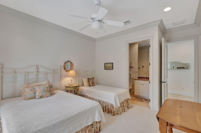 carpeted bedroom featuring connected bathroom, ceiling fan, and crown molding