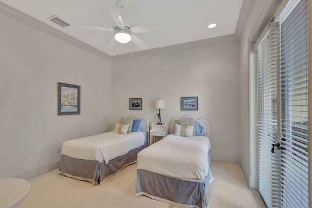 bedroom with ceiling fan, light colored carpet, and crown molding