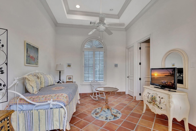 tiled bedroom with a tray ceiling, ceiling fan, a towering ceiling, and ornamental molding