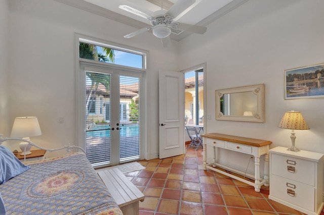 tiled bedroom featuring access to exterior, ceiling fan, and french doors