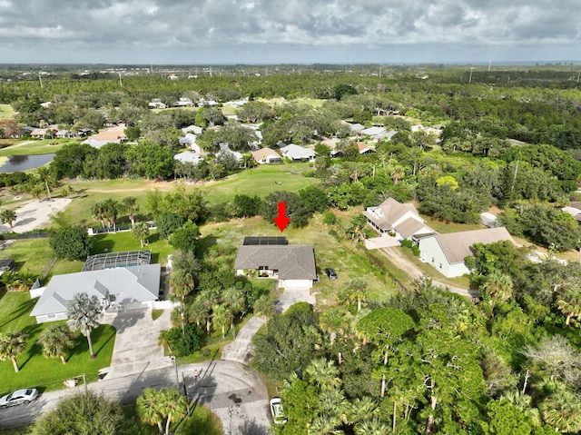 aerial view featuring a residential view and a wooded view