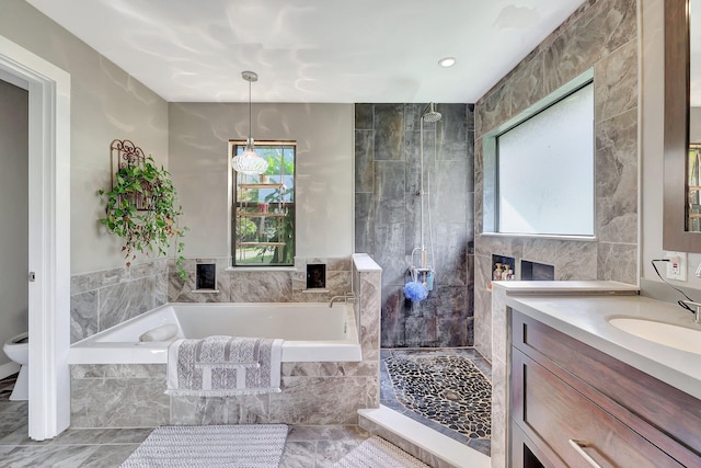 8865 SE May Ter, Hobe Sound, FL 33455 - bathroom featuring a bath, vanity, a stall shower, and toilet