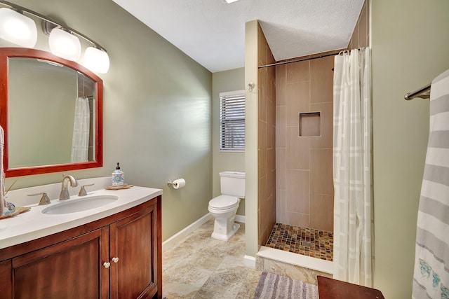 8865 SE May Ter, Hobe Sound, FL 33455 - full bath featuring toilet, baseboards, vanity, and tiled shower