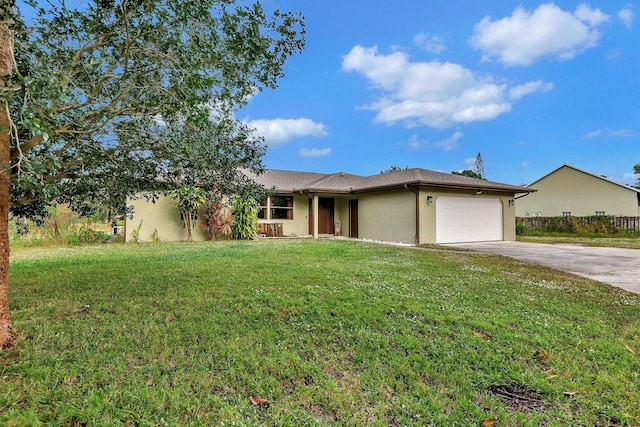 ranch-style home with stucco siding, a front yard, concrete driveway, and an attached garage